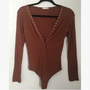 Burnt orange long sleeve bodysuit